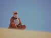 Unveiling the Rich History and Traditions of Tuareg People: A Tribute to our North African Heritage Tuareg family in traditional attire amidst Sahara desert landscape