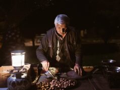 Unveiling the Rich Culinary Heritage of Algeria: A Feast for Maghrebi Diaspora Palates Family enjoying traditional Algerian feast in vibrant street setting