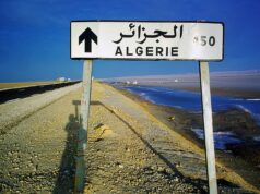The Rise of the Algerian, Tunisian, and Moroccan Diaspora: A Look at Their Changing Status Algerian Tunisian Moroccan individuals in a meeting room, discussing and collaborating on projects