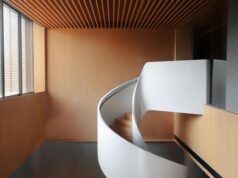 Embracing Maghrebi Elegance: Transforming Modern Spaces with Moroccan Interior Design Inspiration Moroccan interior design - Colorful tiled room with traditional rug and arched windows