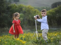 A Photographer’s Sartorial Chronicle: Unraveling Moroccan Youth Culture A photographer capturing vibrant Moroccan youth in traditional clothing at a market