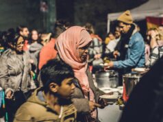 Algeria’s Leading Role in International Cultural Events: A Source of Pride for the Maghrebi Diaspora Algerian woman proudly watching an international cultural event