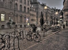 Discovering the ‘St Tropez of North Africa’: an affordable vacation hotspot Woman walking along the colorful streets of Essaouira, Morocco, with the ocean in the background