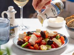 A Fresh and Delicious Light Moroccan Salad Recipe for Iftar A colorful Light Moroccan Salad on a wooden serving platter with fresh mint leaves, tomatoes, cucumbers, and olives.