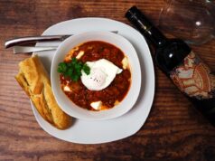 Mastering Authentic Shakshuka: A Comprehensive Guide for Maghrebi Diaspora Readers family enjoying authentic shakshuka around Moroccan table