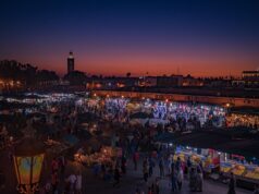 Journey through Morocco: Unveiling Condé Nast Traveller’s Latest Shoot – A Glance for Maghrebi Diaspora Readers Woman walking in traditional Moroccan market with Condé Nast Traveller magazine
