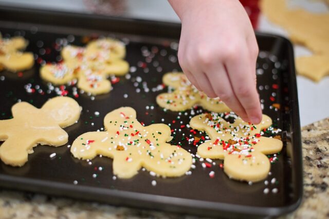 family baking traditional maghrebi cookies for eid al fitr celebration