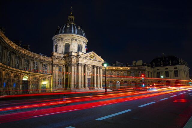 North African individuals navigating the streets of Paris, symbolizing their journey in France