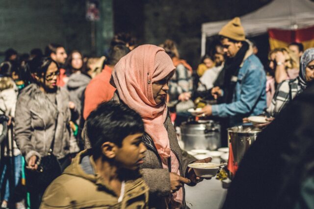 Crowd enjoying Lebanese dishes at a lively festival in West Scranton
