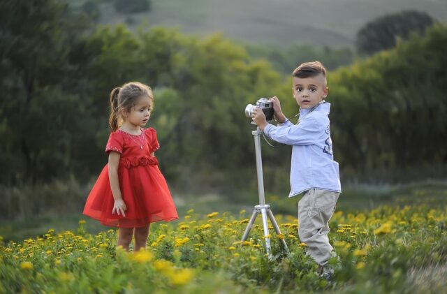 Moroccan youth in colorful traditional clothing posing for a photographer