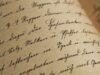 Exploring Medieval Moroccan Couscous Recipes in Egyptian Manuscripts Scholar studying ancient Arabic manuscript containing medieval Moroccan couscous recipe
