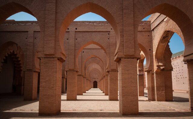 North African family exploring ancient ruins in desert backdrop