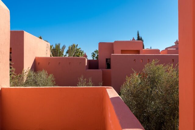 Maghrebi family exploring a sustainable eco-resort in Marrakech, Morocco