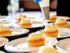 Exploring Algerian Gastronomy: A Modern Look at Culinary Art Across Algeria Chef preparing modern Algerian dish in bustling market