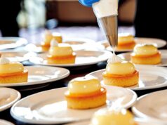 Exploring Algerian Gastronomy: A Modern Look at Culinary Art Across Algeria Chef preparing modern Algerian dish in bustling market