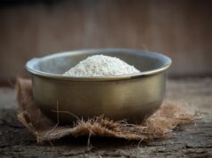 Savoring the Traditional Sweetness: Date-Filled Semolina Cookies – A Maghrebi Pastry Legacy woman making date-filled semolina cookies, traditional Maghrebi pastry, makrounes maamoul recipe