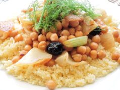 Uniting Across Borders: Ramadan’s Maghrebi Couscous Celebration Family enjoying Maghrebi couscous feast during Ramadan in traditional setting