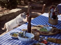 Three Tunisian Recipes to Elevate Your Mediterranean Diet Three vibrant Tunisian dishes on a rustic tabletop, showcasing fresh seafood and spices