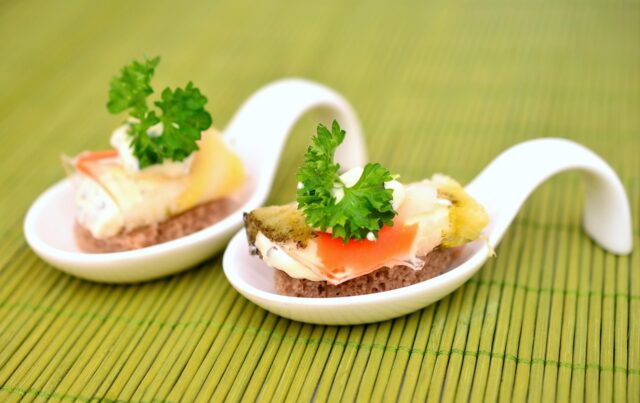 a beautifully presented Couscous Royale dish with various meats, vegetables, and spices on a serving platter