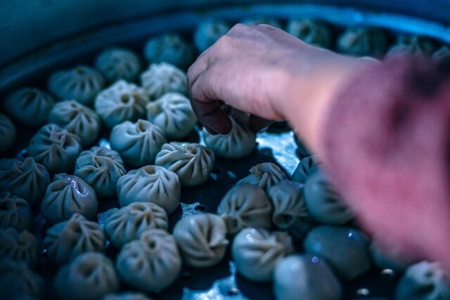 Tunisian Yabrak Preparation Woman preparing Tunisian stuffed grape leaves for a Passover feast in Marseille
