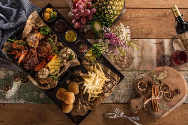 Amazigh family enjoying traditional delicacies during Yennayer Feast