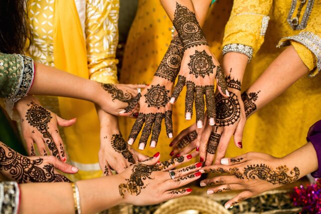 Henna Bride Hand Close-up of intricate, colorful henna tattoo design on a bride's hand at a Maghrebi wedding