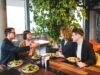 The Rise of Halal Brunch: A Celebration of Muslim Culture in Entertainment Group of people enjoying a halal brunch, featuring Middle Eastern dishes and vibrant decor
