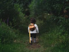 Rediscovering Roots: Young French Jews Exploring Their Maghrebi Heritage – An Empowering Journey Young French Jewish adults laughing and sharing stories with older Maghrebis in a communal setting