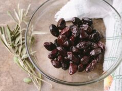 Preserved Lemons: A Comprehensive Guide for a Maghrebi Kitchen Woman preparing preserved lemons in a traditional Moroccan kitchen