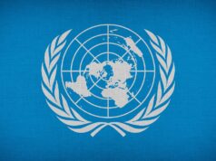 Exploring Happiness Trends in the Maghreb: Insights from the 2025 World Happiness Report United Nations logo with World Happiness Report document and Maghrebi flag