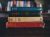 Revolutionary Novels and Stories by Arab Women to Read This Year: Empowering Voices from the Maghrebi Diaspora Women of the Maghrebi diaspora holding books, revolutionary novels by Arab women on display