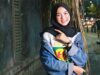 Tracing the Evolution and Impact of Contemporary Muslim Fashion on Global Style Woman wearing modern hijab in diverse cityscape