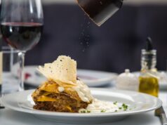 Algerian Halal Food Scene Flourishes in Lawrence: Embracing ‘Radical Hospitality Algerian family enjoying halal food at restaurant in Lawrence