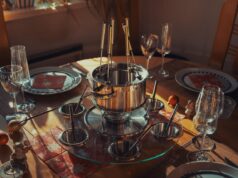 Rediscovering Authentic Tunisian Recipes for a Taste of Home A family gathering around a table filled with authentic Tunisian dishes