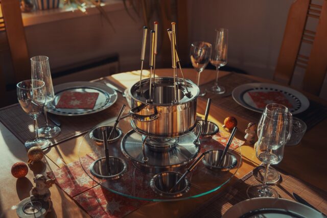 Authentic Tunisian Feast A family gathering around a table filled with authentic Tunisian dishes