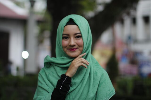 Contemporary Muslim woman wearing a colorful, stylish modest fashion outfit