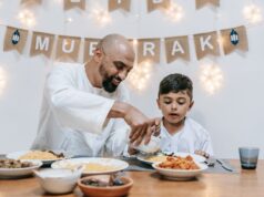 The Rise of Arab Comfort Food in the US: A Taste of Home family enjoying arab comfort food in a modern american restaurant