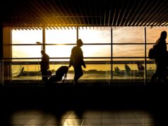 Flying to the Middle East and North Africa with Miles: A Comprehensive Guide for the Maghrebi Diaspora Maghrebi diaspora member holding passport and boarding pass at airport