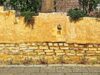 Tadelakt Technique: Sustainable Moroccan Wall Finish Redefining Design Moroccan woman applying tadelakt finish on a wall