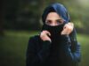 Embracing Contemporary Muslim Fashion: A Comprehensive Guide for the Maghrebi Diaspora Maghrebi woman in contemporary hijab walking through a fashion market