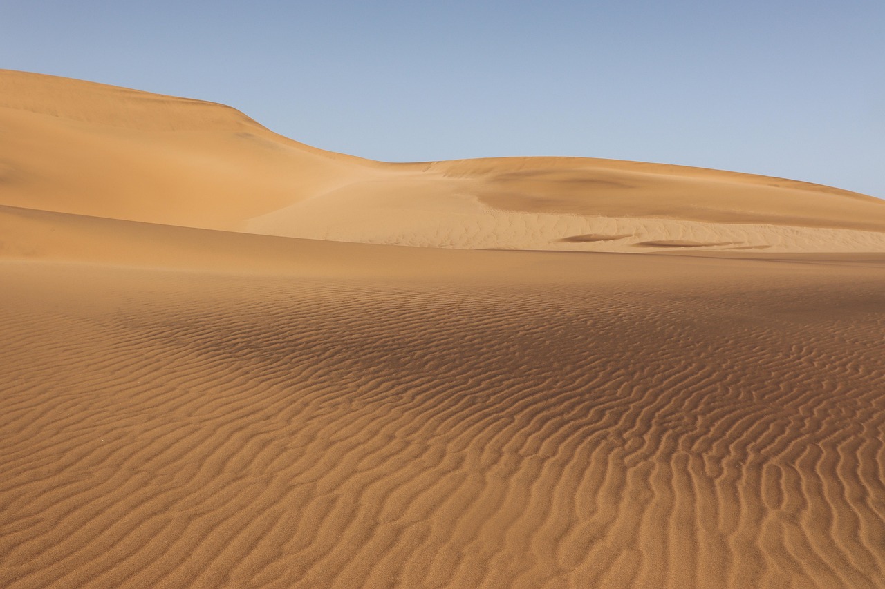 Family enjoying traditional Algerian meal in a desert setting