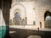 Discovering the Charm of Moroccan Riads: Your Home Away from Home on Airbnb Moroccan Riad with a tranquil courtyard, featuring a fountain, palm trees, and cozy seating