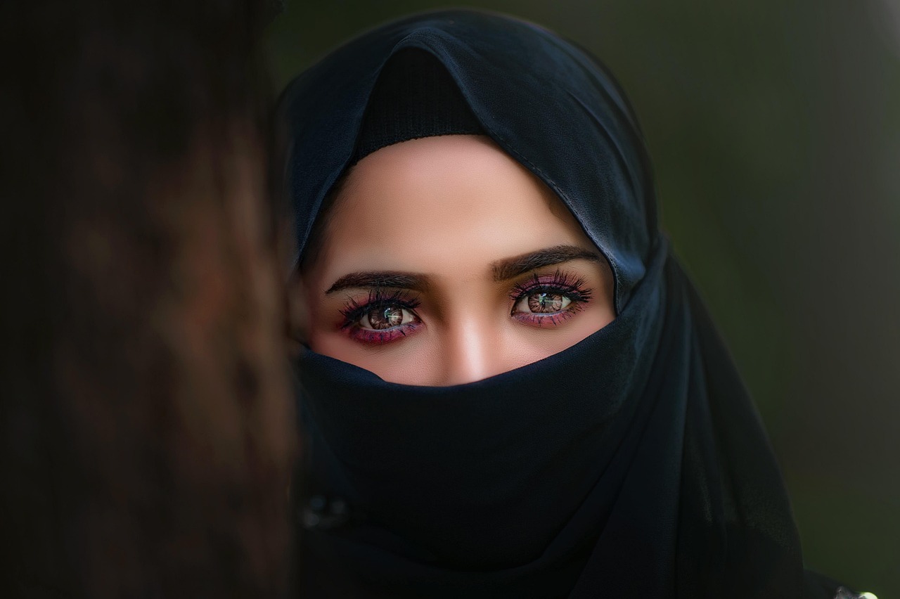 Modern Muslim woman wearing a contemporary hijab and traditional Maghrebi dress