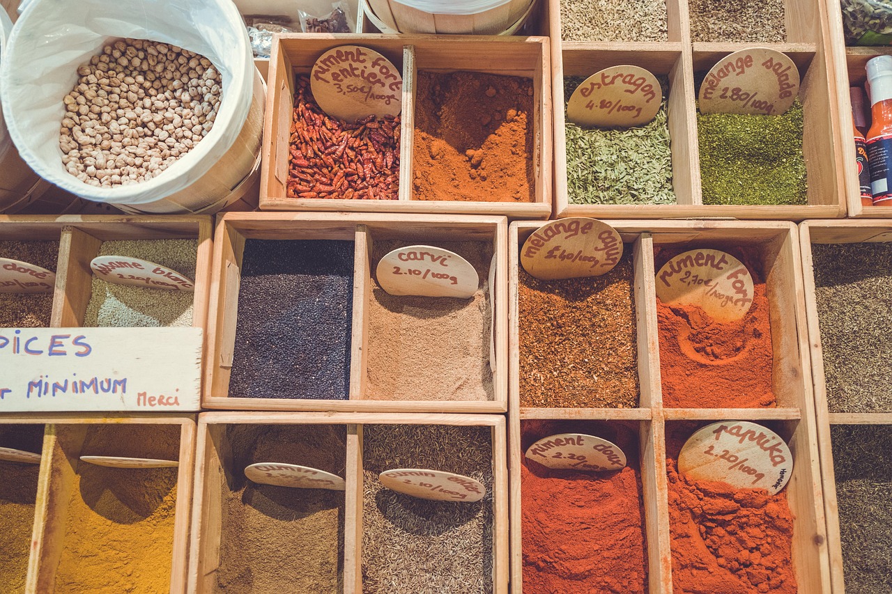 A group of women preparing coconut curry chickpeas in a vibrant Moroccan kitchen