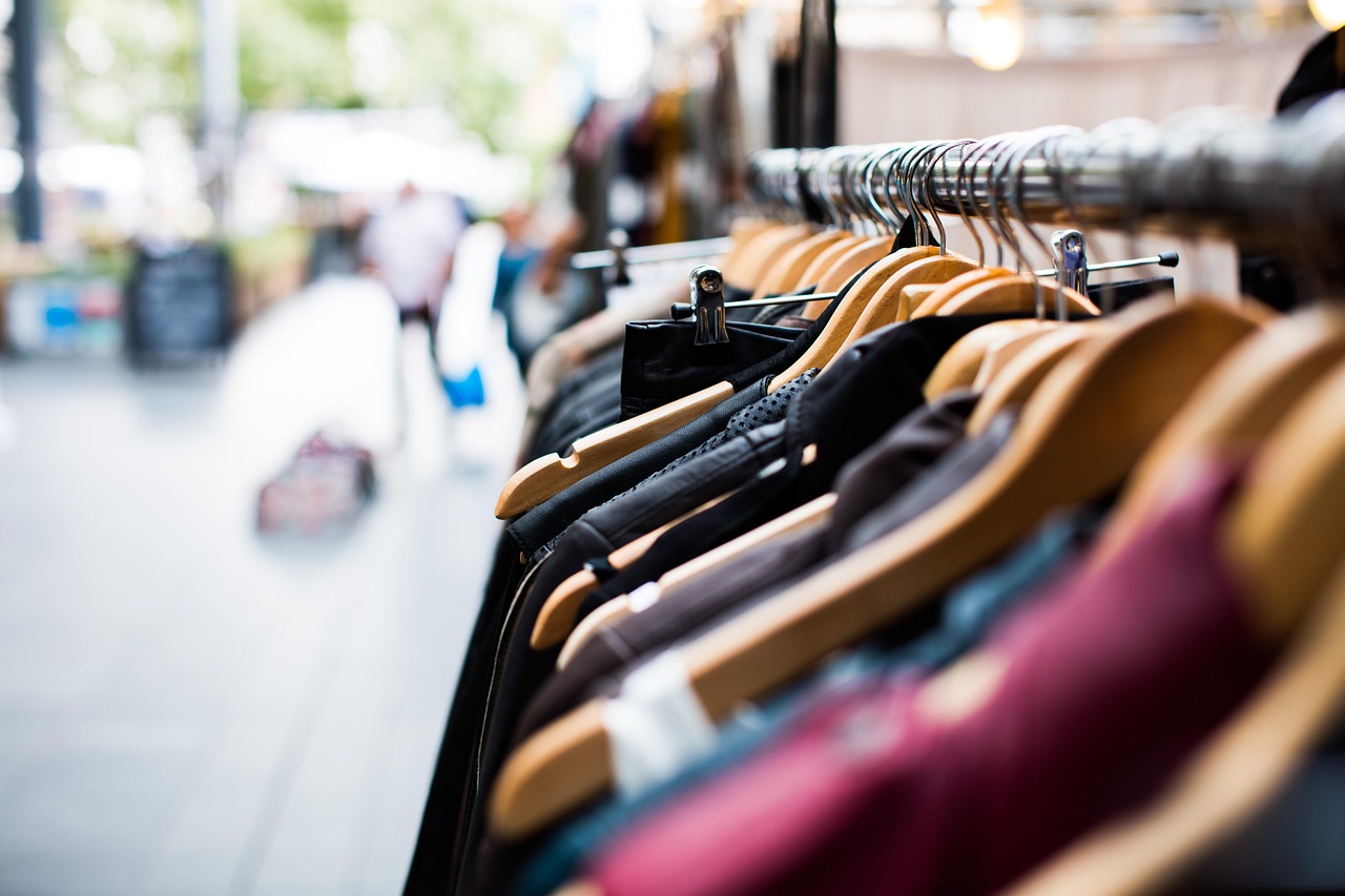 Maghrebi woman wearing a stylish hijab at a bustling Islamic clothing market